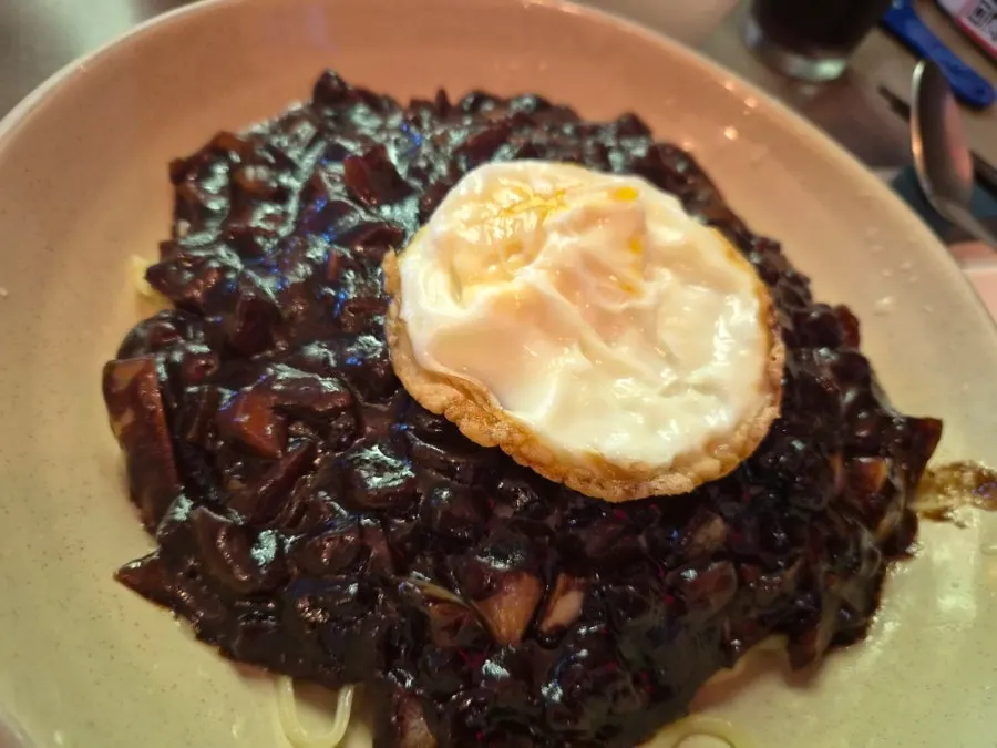 Jjajangmyeon topped with a fried egg