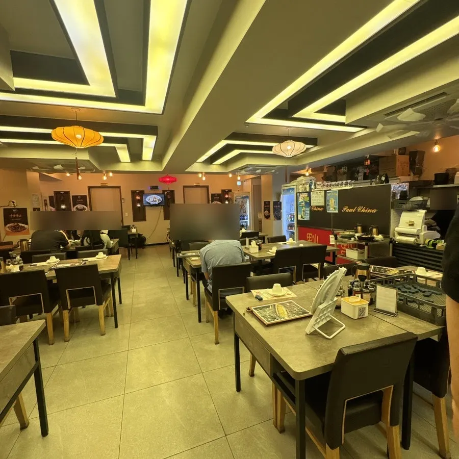 Main hall seating at Baoro China with wide table spacing
