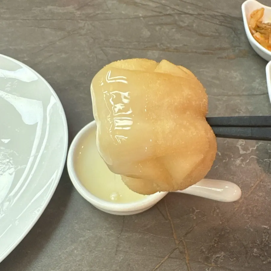 A plate of freshly fried, golden flower bread