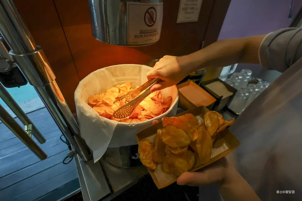 Self-serve potato chip bar under warm lighting