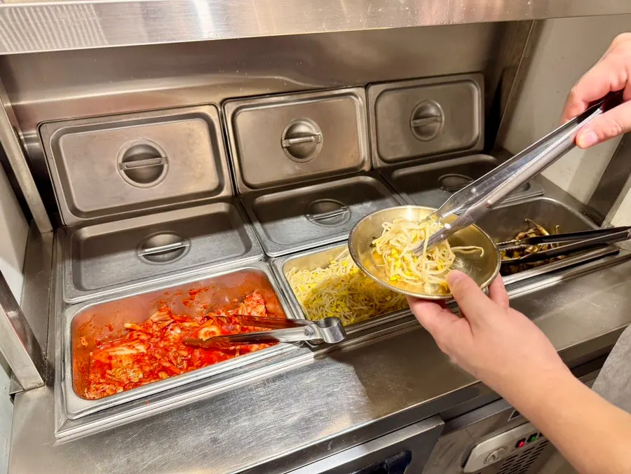 Kimchi and bean sprouts at the self-serve bar
