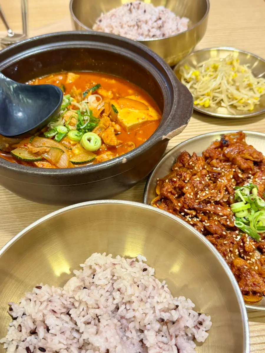 Generously plated stew and bulgogi spread