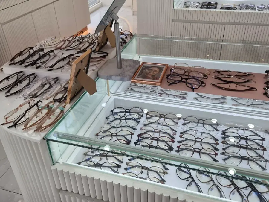 Display shelf of frames in various shapes and colors