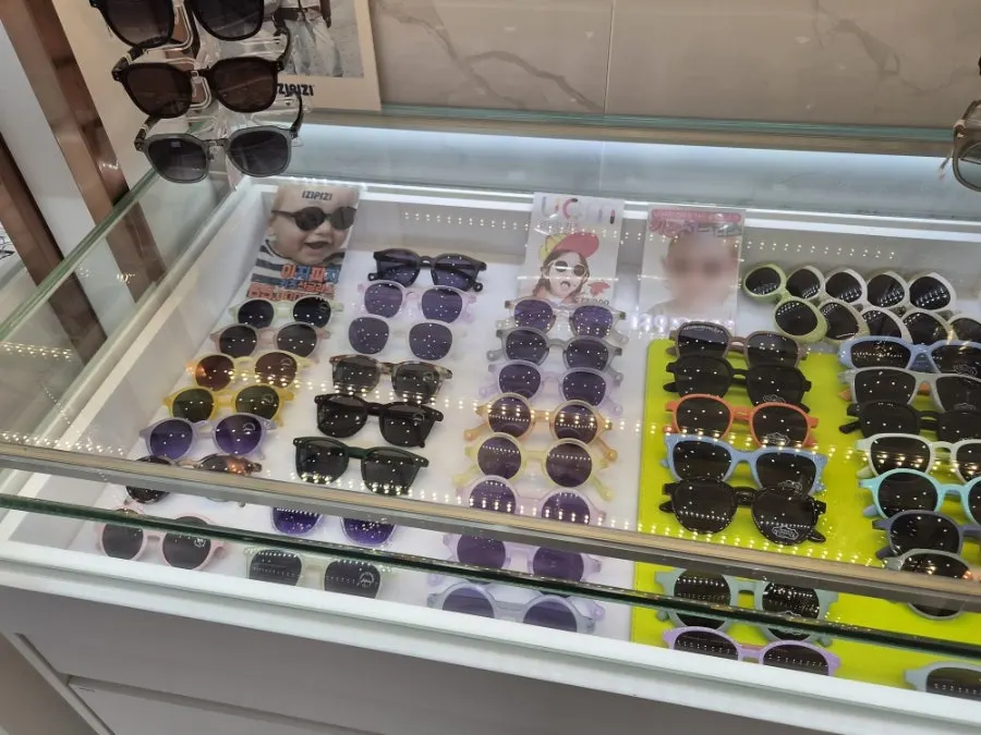 Display of children's sunglasses in various sizes