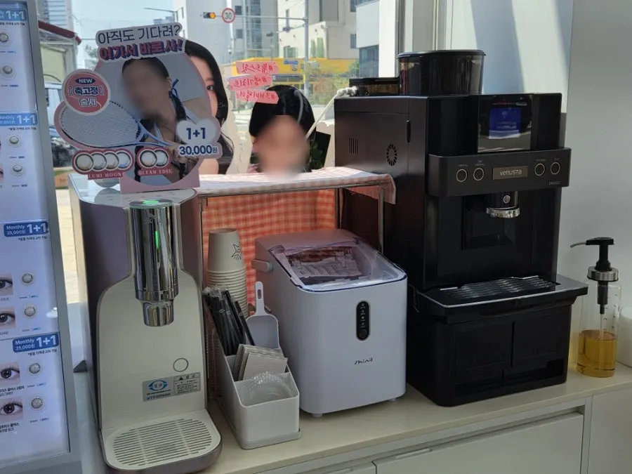 Coffee machine and water dispenser waiting area in a corner of the store