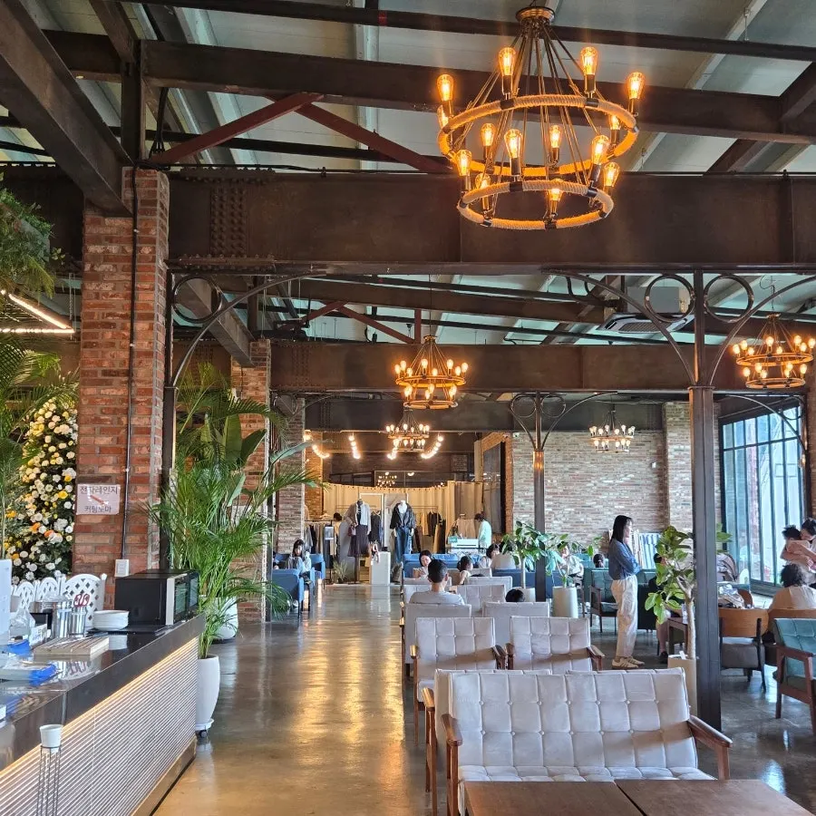 Barirus interior with high ceilings and floor-to-ceiling windows