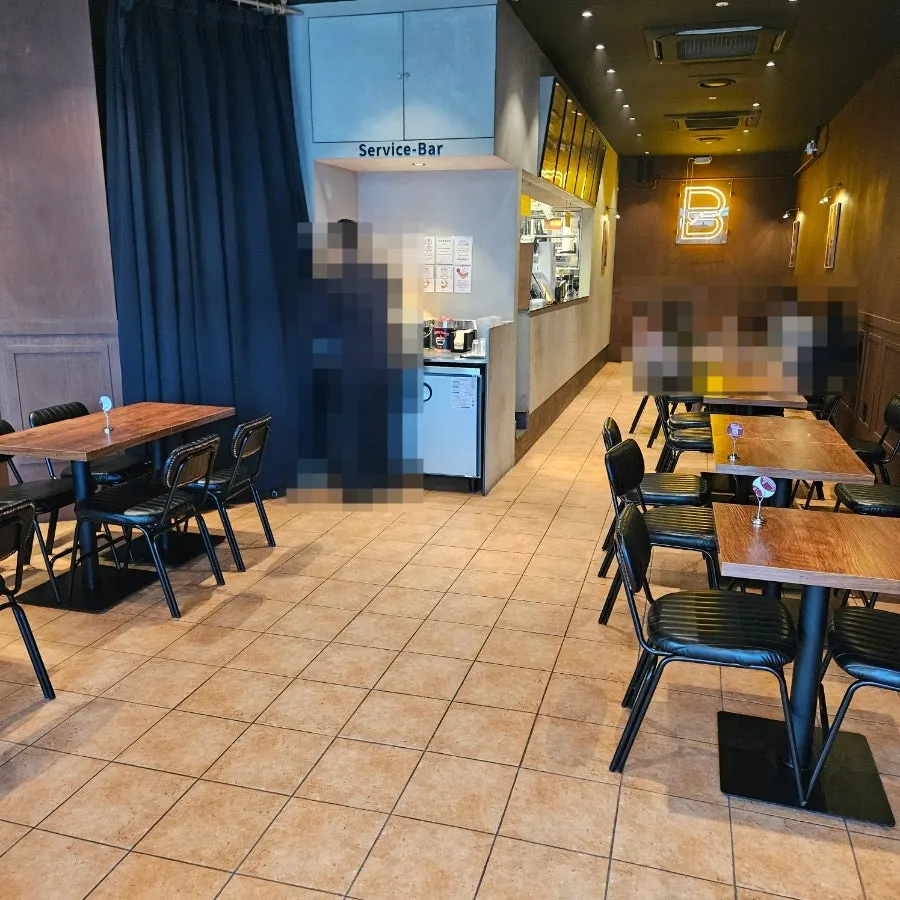 Interior of Base Burger with generously spaced tables