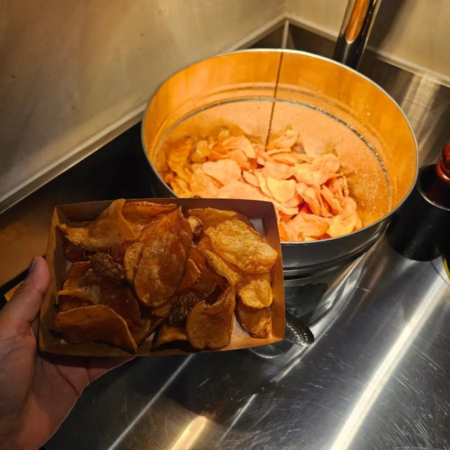 Potato chips being served at the table