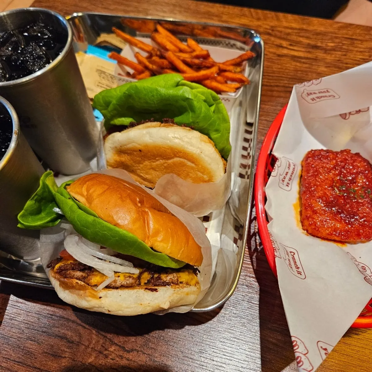 Double Base Burger and Mushroom Burger combos set out on the table