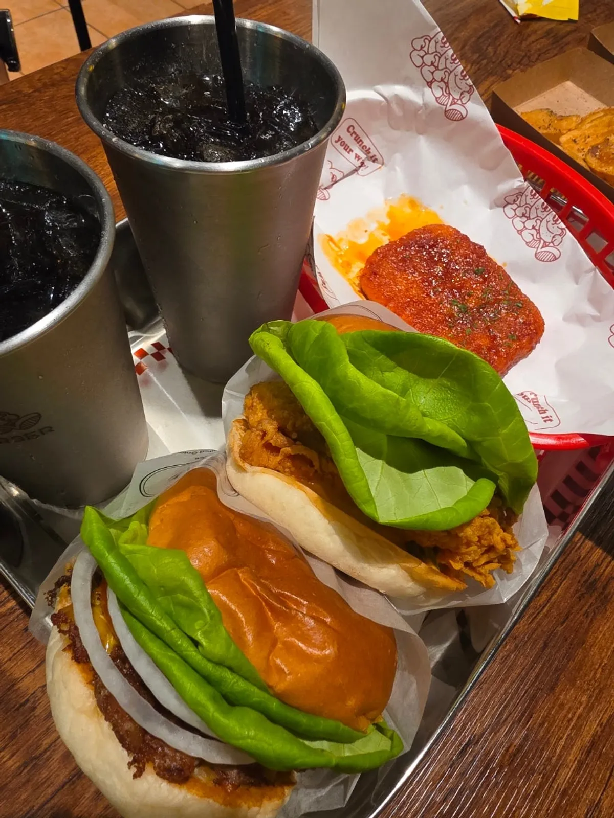 Full spread of burgers and sides at Base Burger Gwanggyo Avenue France Branch