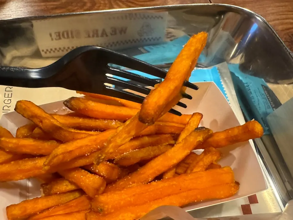 Sweet potato fries paired with a burger for a sweet-and-salty combo