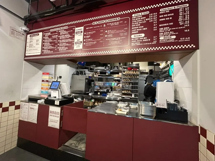 Interior of Bas Burger Jamwon Branch with cooking area and counter