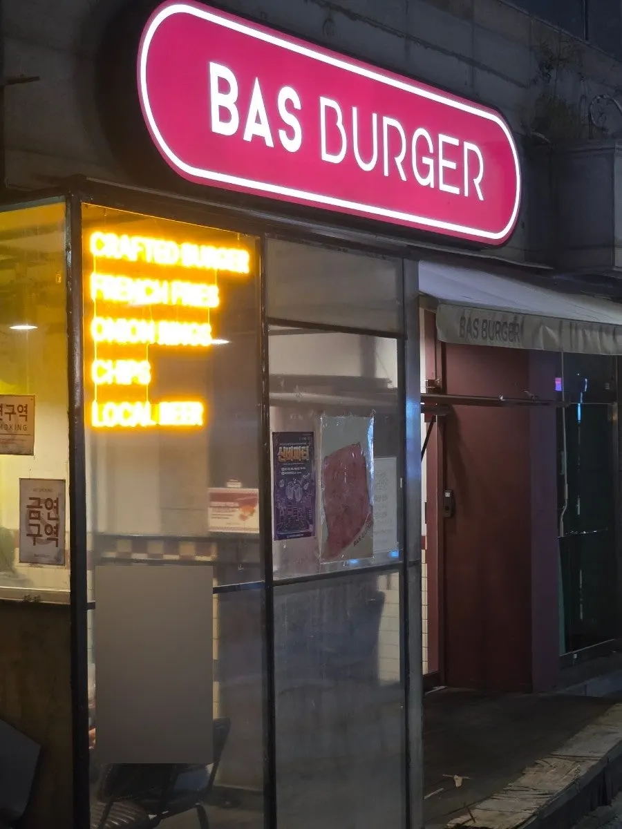 Casual handmade burger shop entrance seen through the glass window