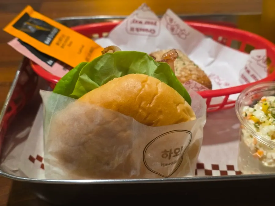 Burger and beer arranged as a solo after-work drink spread
