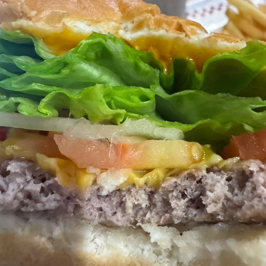 Cross-section of the burger showing a thick beef patty