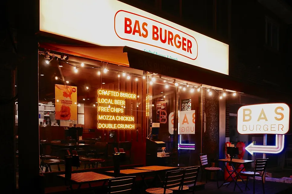 Lit-up building front of Bas Burger Seongsu