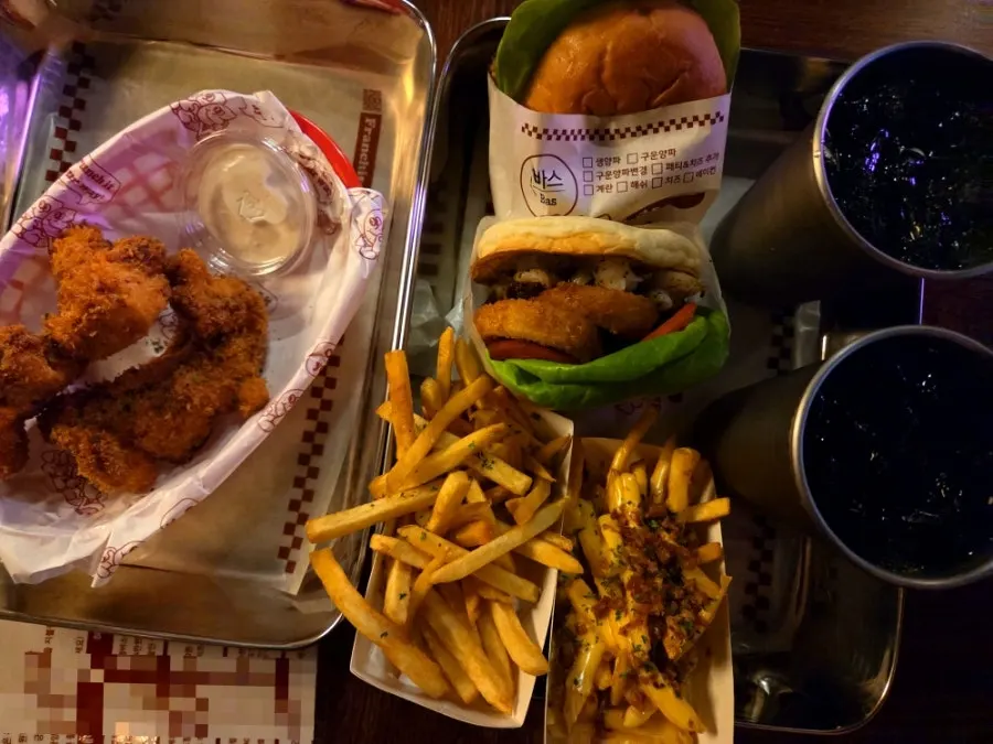 Table set with two burger sets and crunch chicken