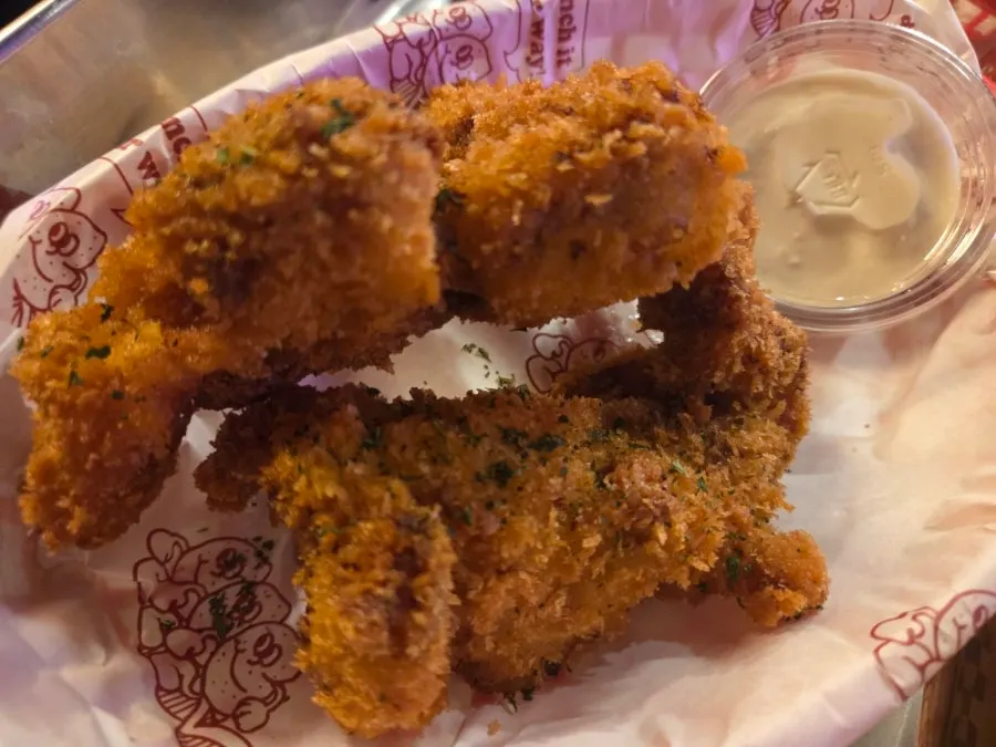 Two large pieces of BAS Burger crunch chicken (leg cut)