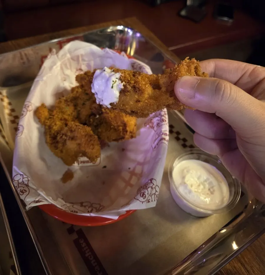 Cross-section of a bitten crunch chicken piece