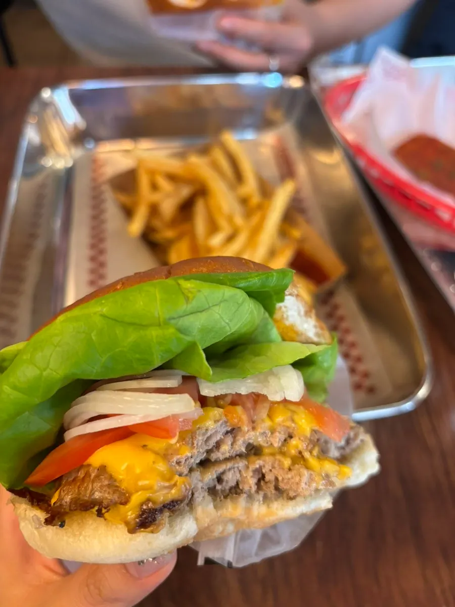 Cross-section of the Bass Burger showing patties and vegetables