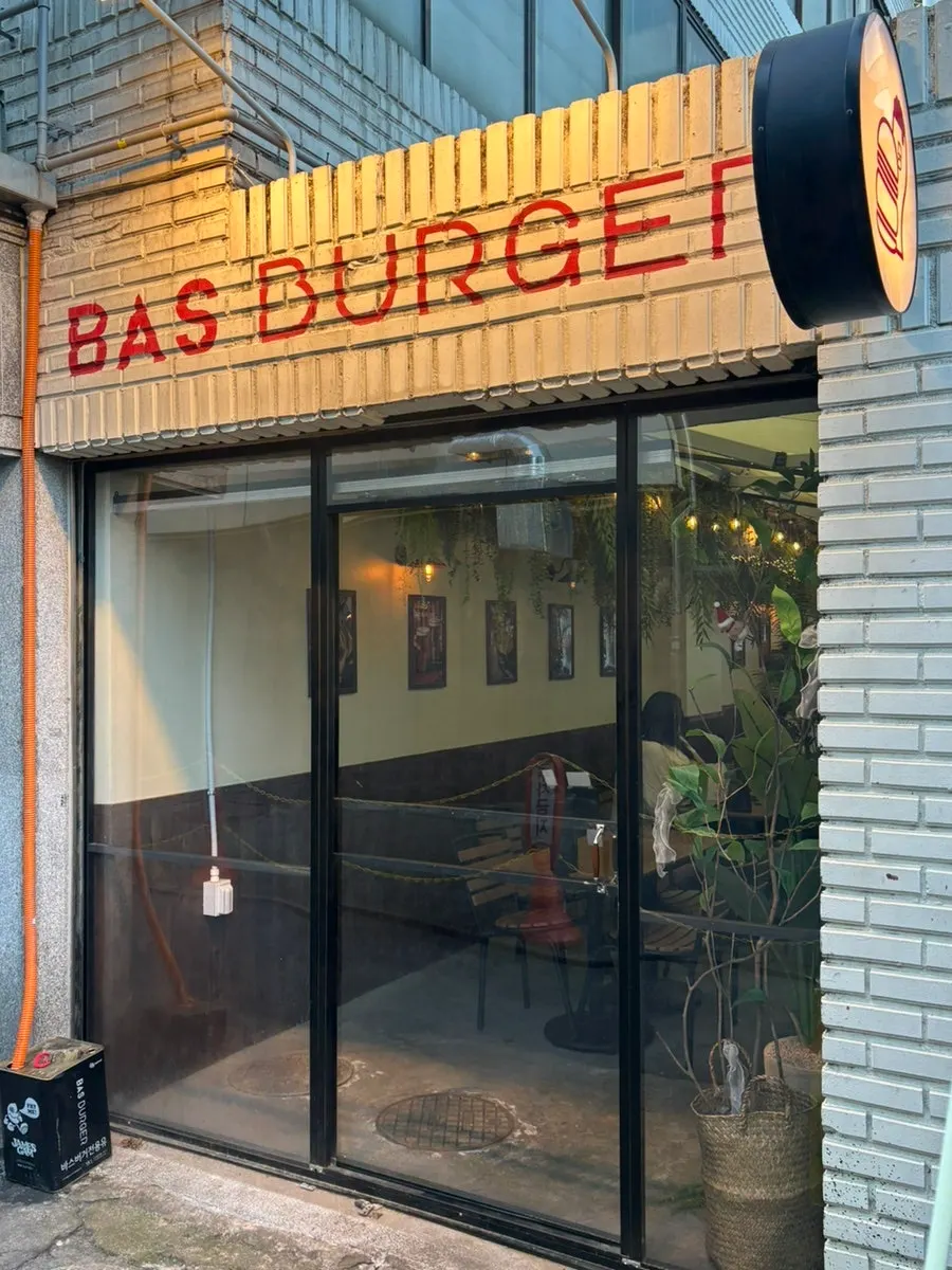 Seating at Bass Burger Sinyongsan with the Yongridan-gil mood