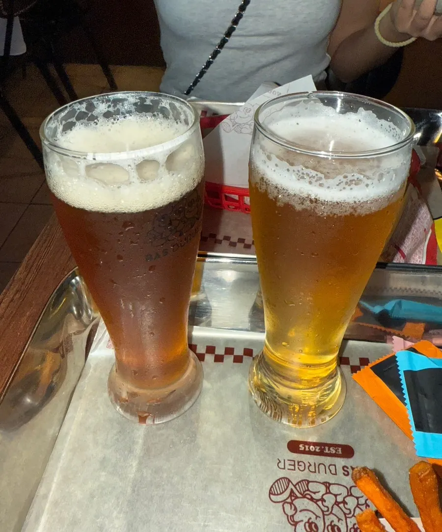 Two glasses of Cheongjin-dong and Bass Lager craft beer
