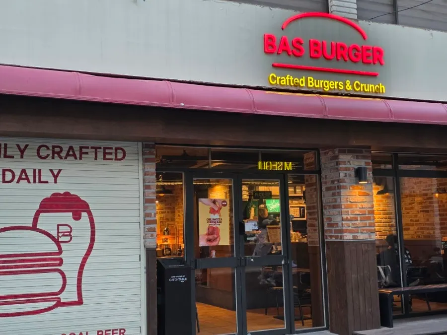 Bass Burger Sinyongsan's red sign and brick exterior