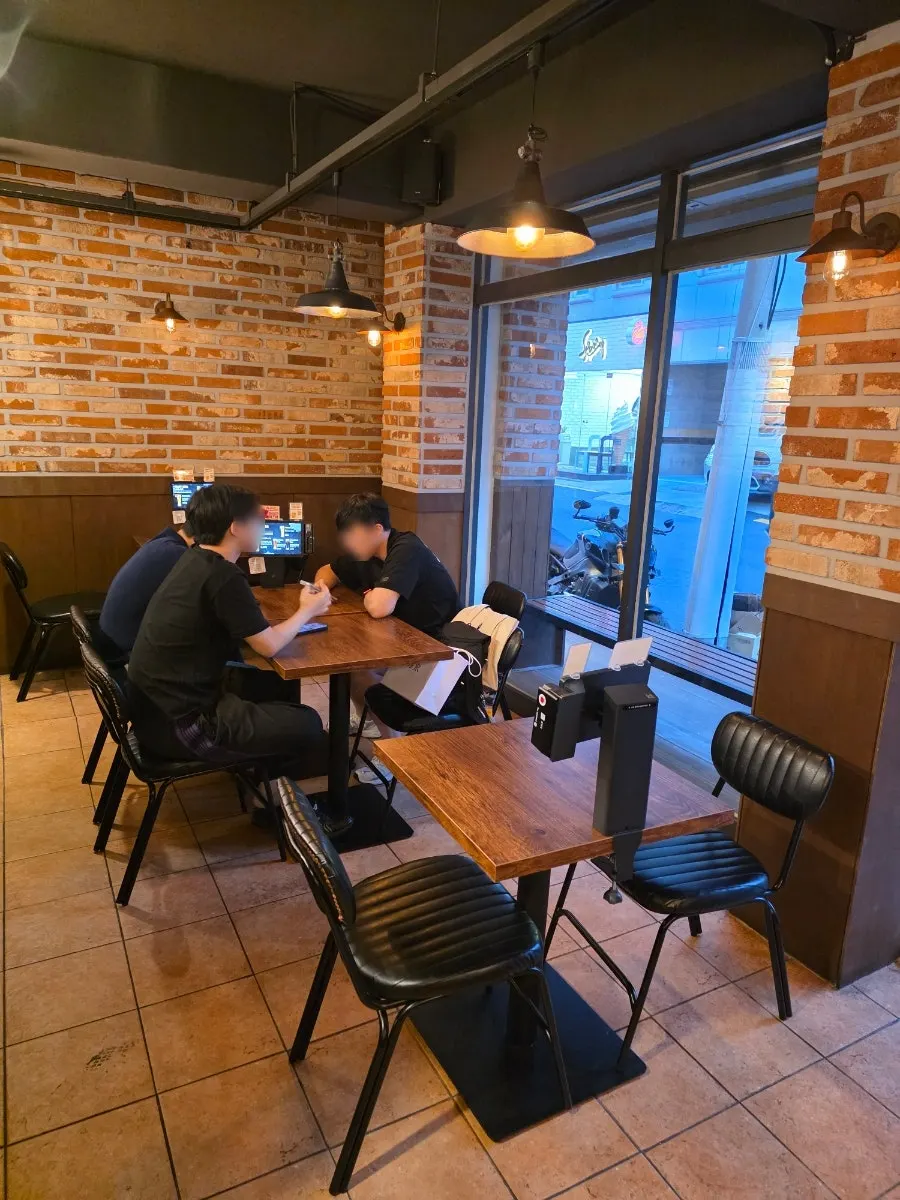 Interior with brick walls and wood tables