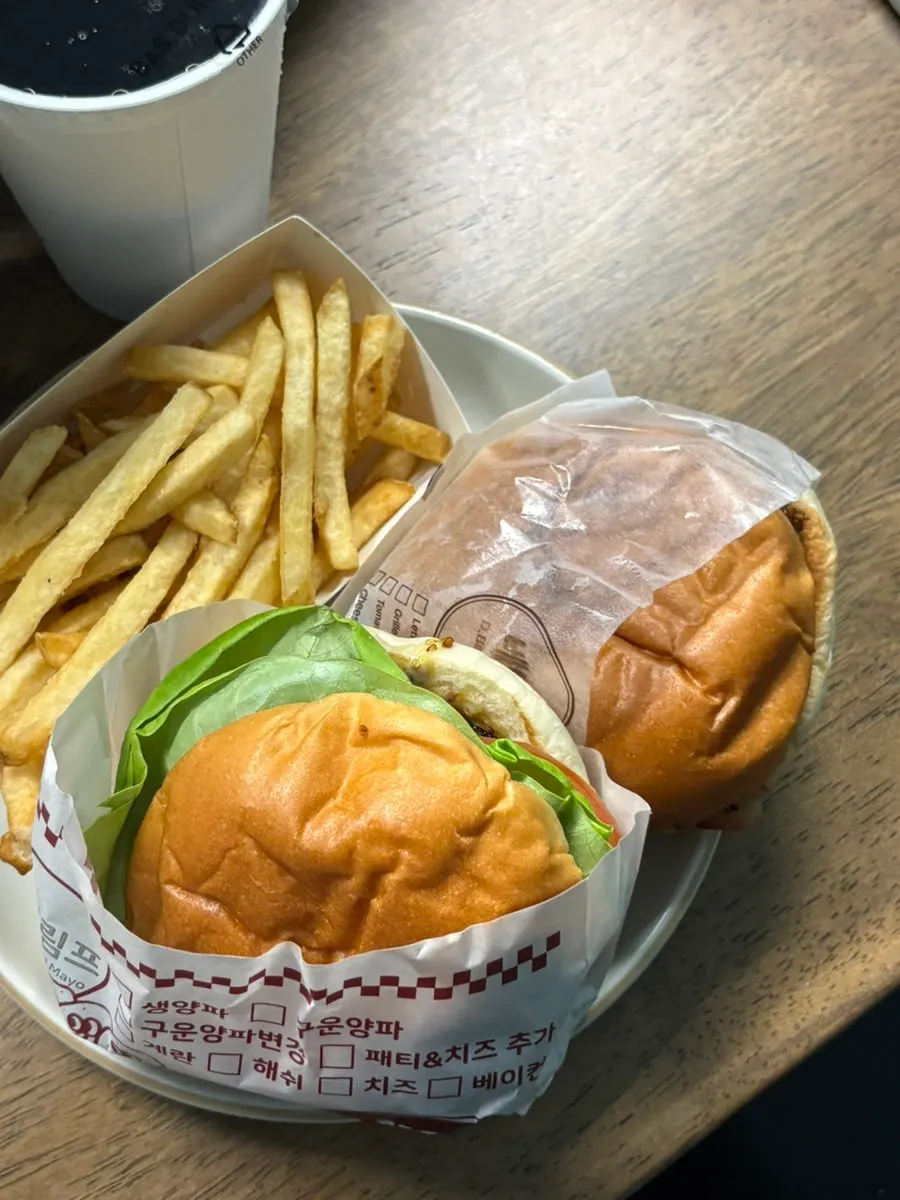 Double bacon cheeseburger served with French fries