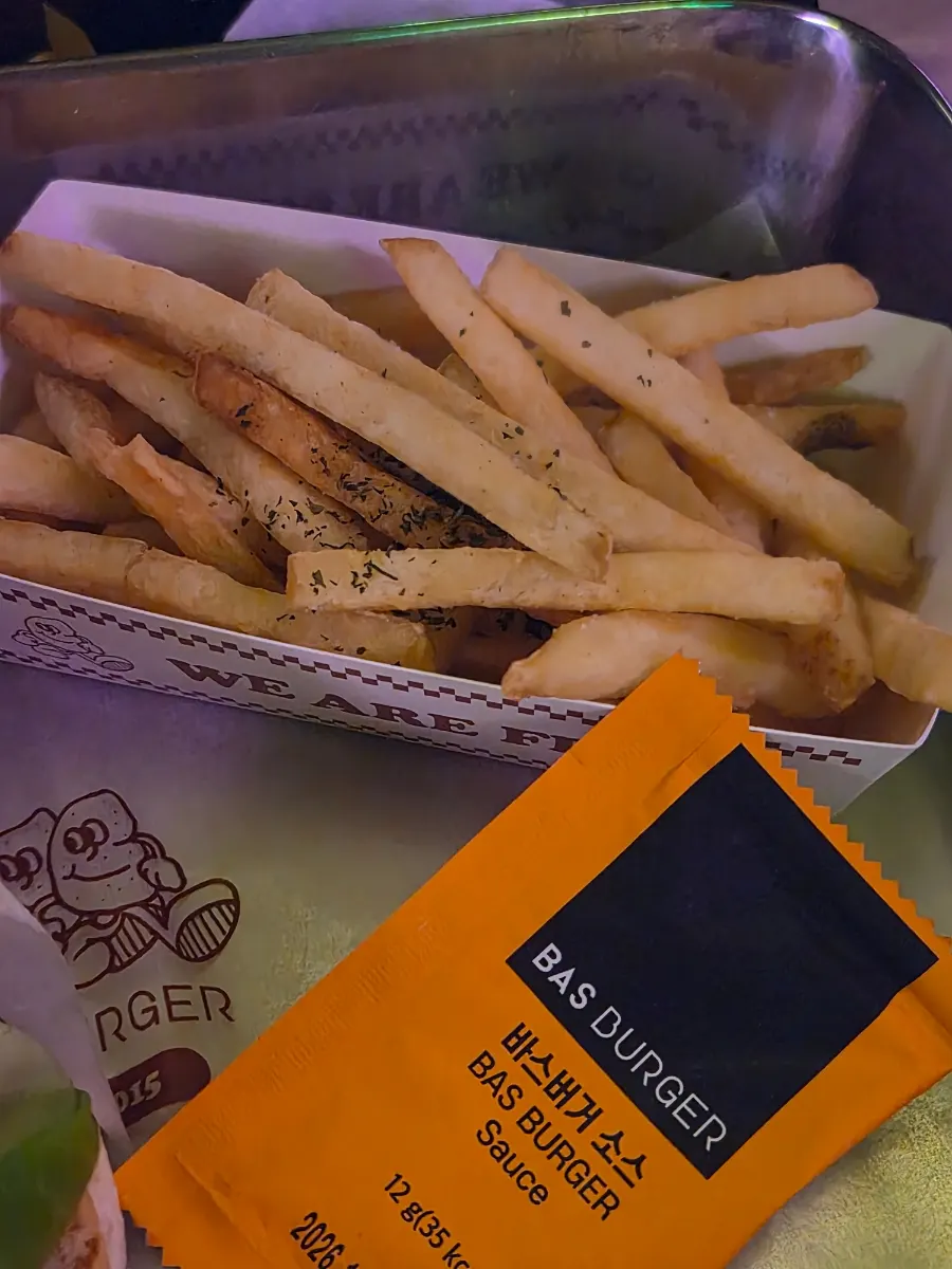 A spread of burgers and fries together