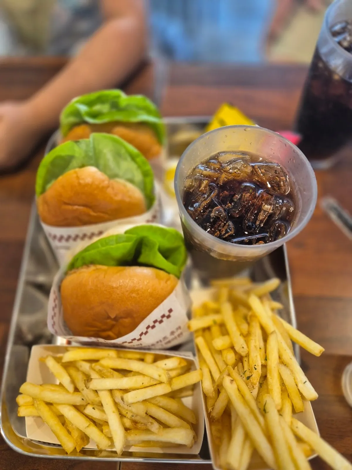 Table with handmade burgers and fries