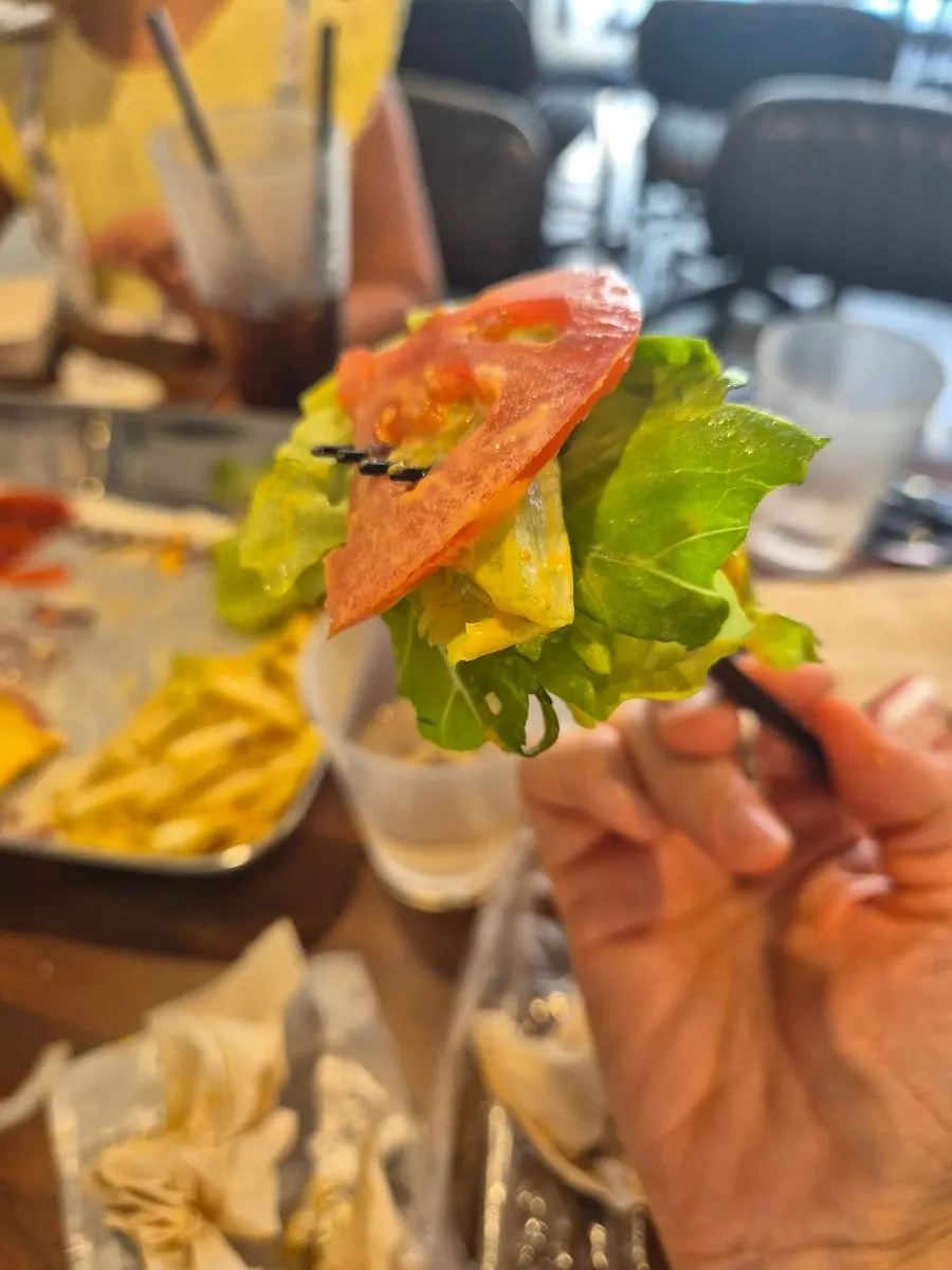 Table sharing three handmade burgers