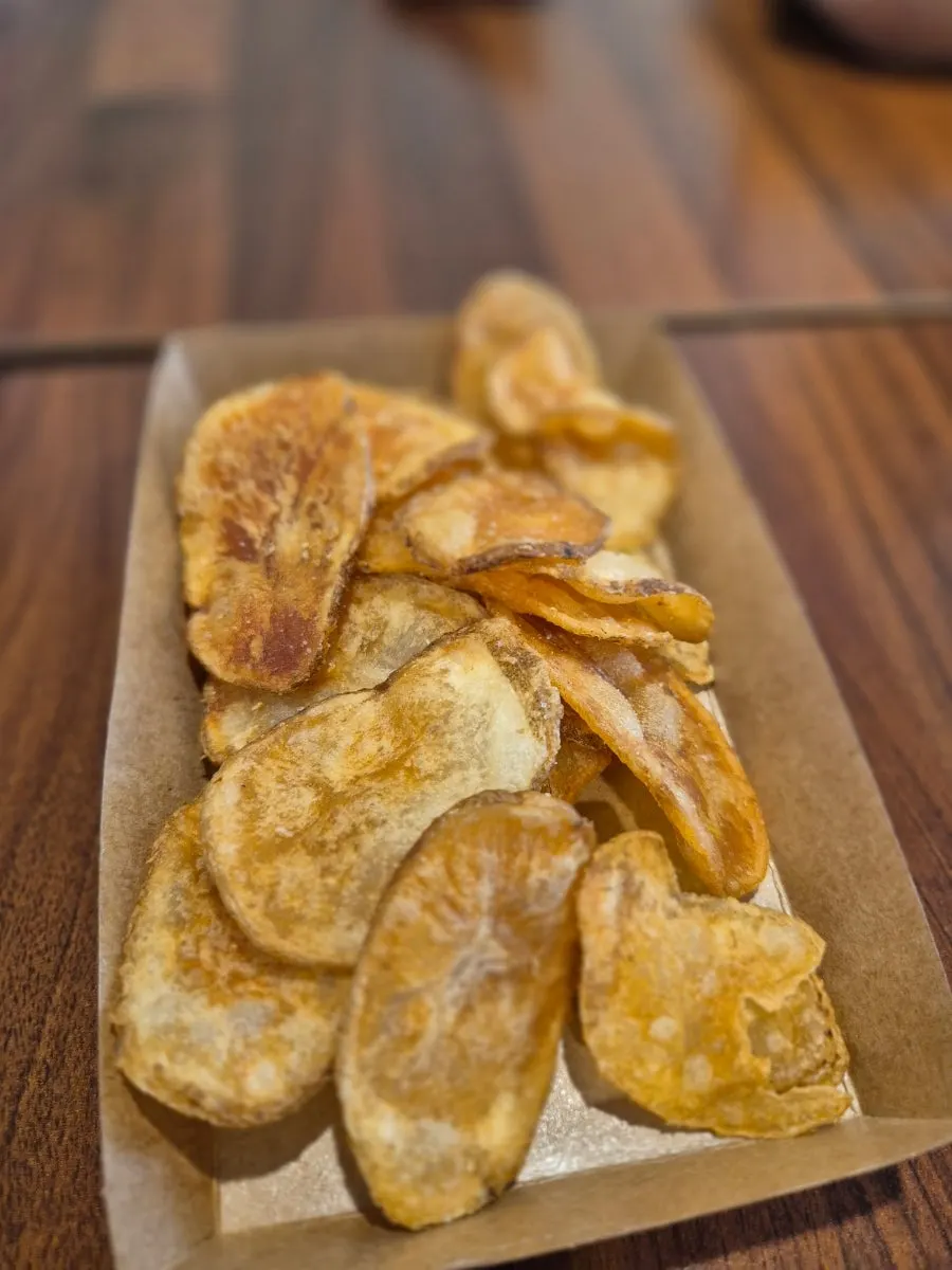 Several kinds of sauce set out at the self-serve bar