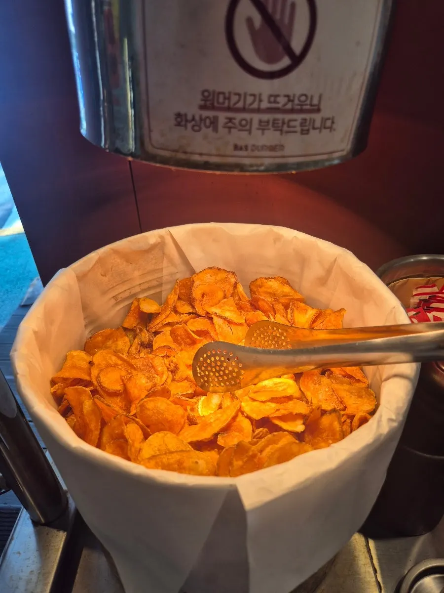 Thick handmade chips sprinkled with salt and pepper