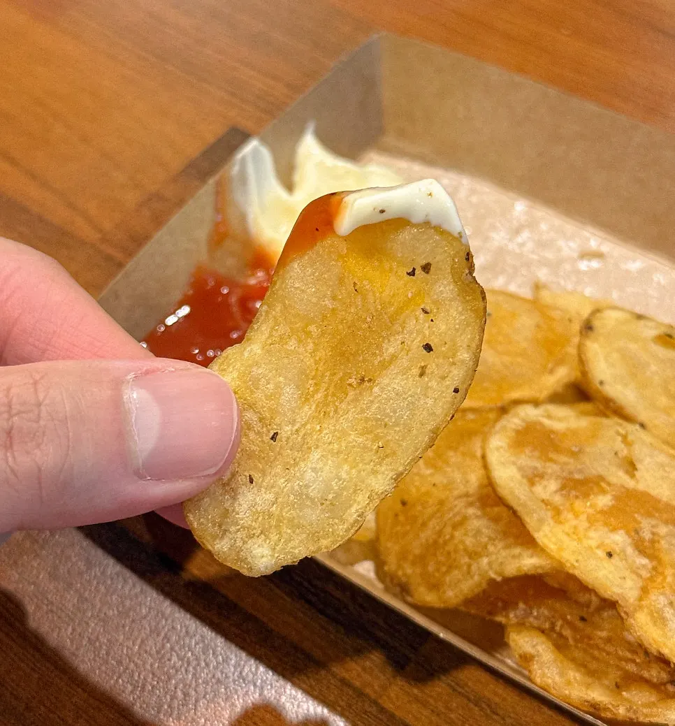 Close-up of Bas Burger fries that look like potato chips