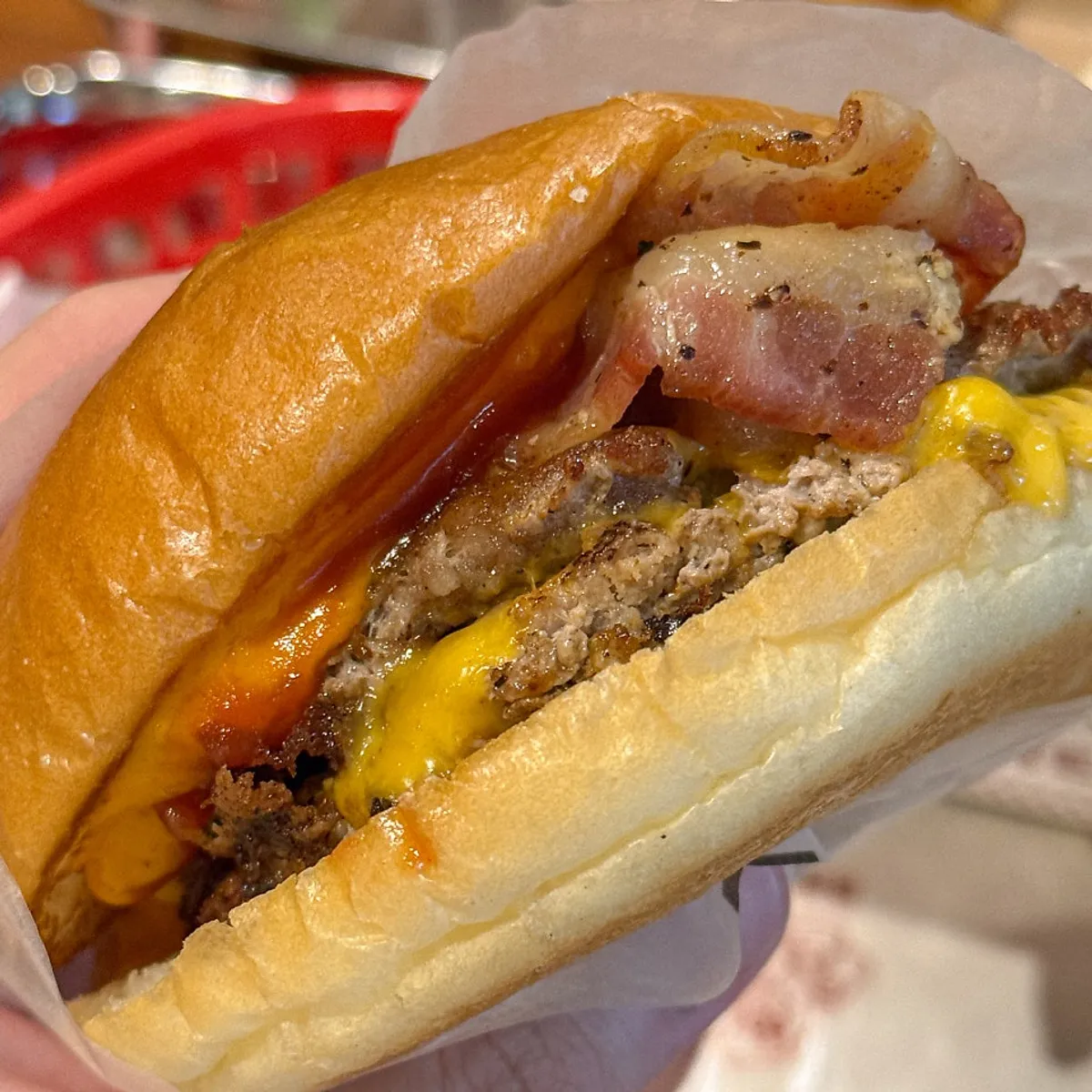 Double bacon cheeseburger with two patties and layered bacon