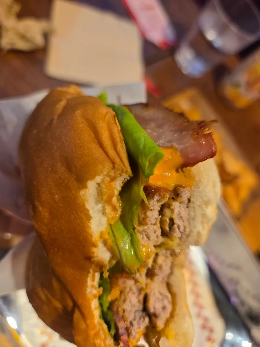 Fillings visible in a bitten handmade burger