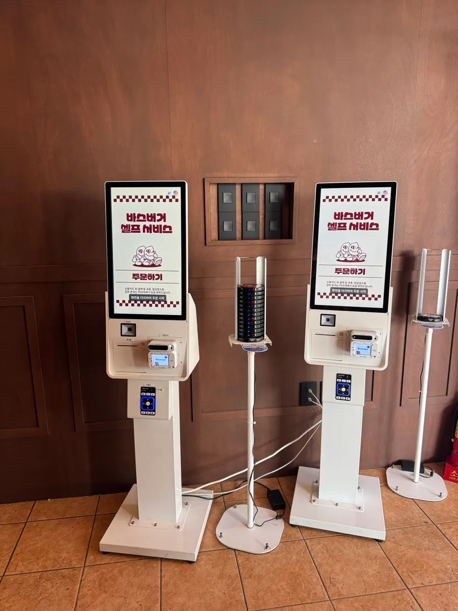 Two ordering kiosks inside Base Burger