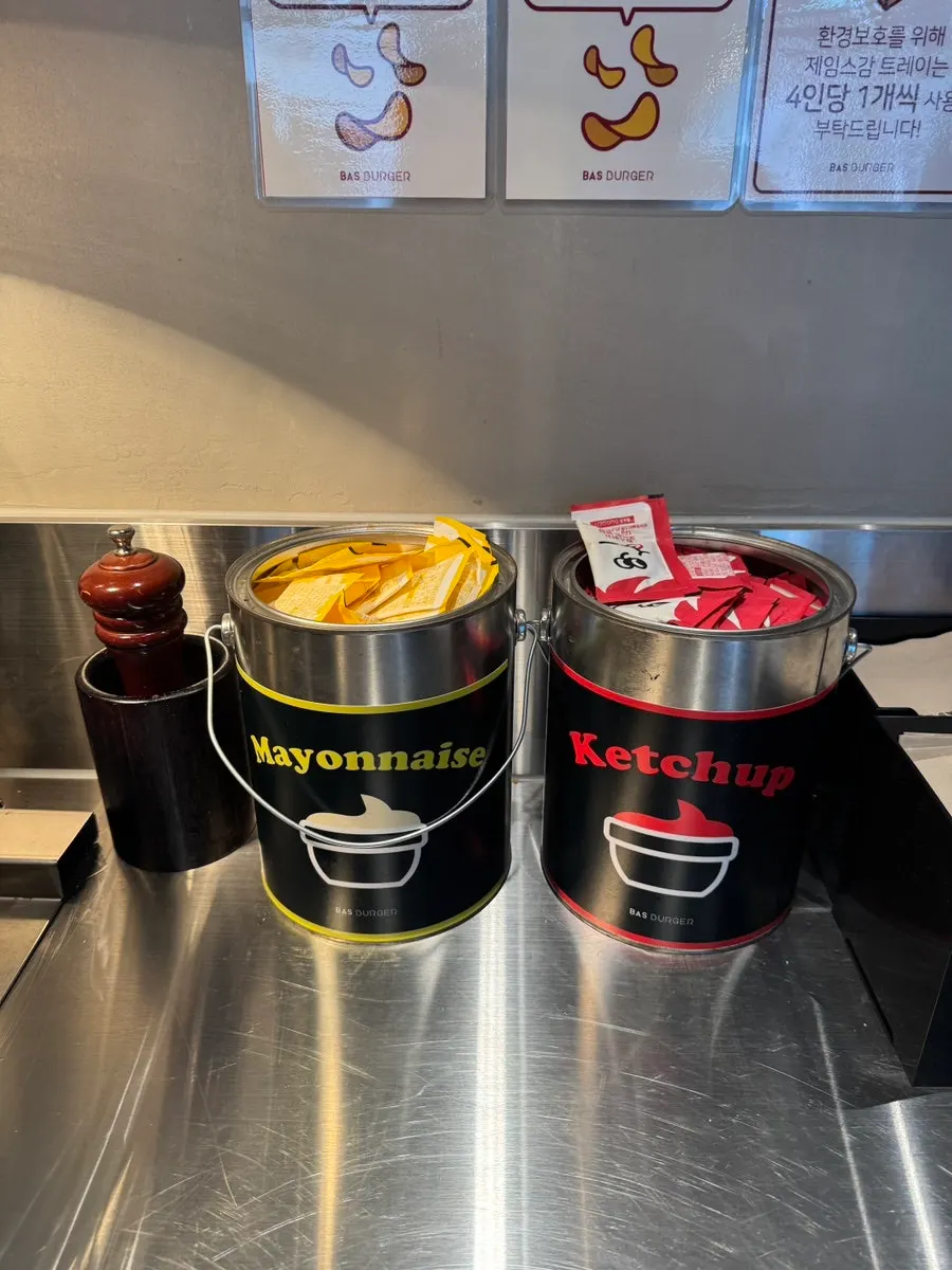 Individually packaged mayonnaise and ketchup at the self-serve corner