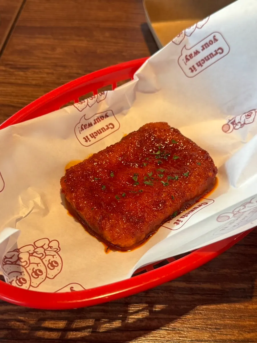 Close-up of the spicy sauce coating the chilli mozza cheese bar