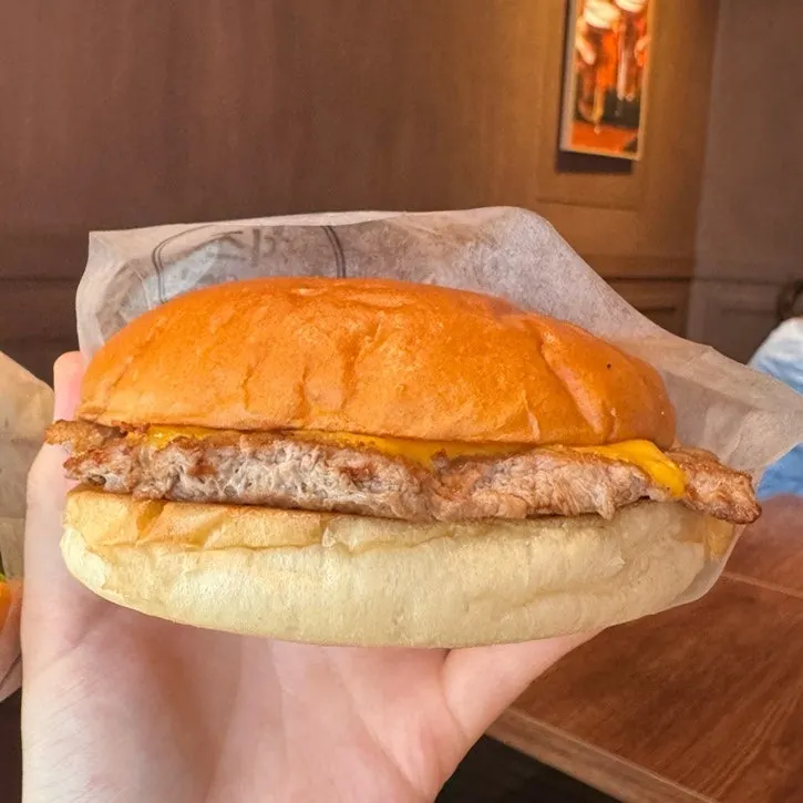 Cross-section of the sriracha cheese burger showing patty and cheese