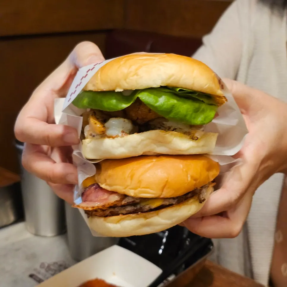 A handmade burger so loaded it's hard to hold with two hands