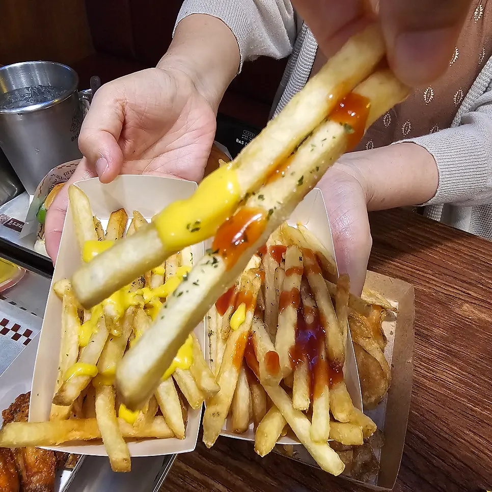 French fries with mustard sauce and ketchup