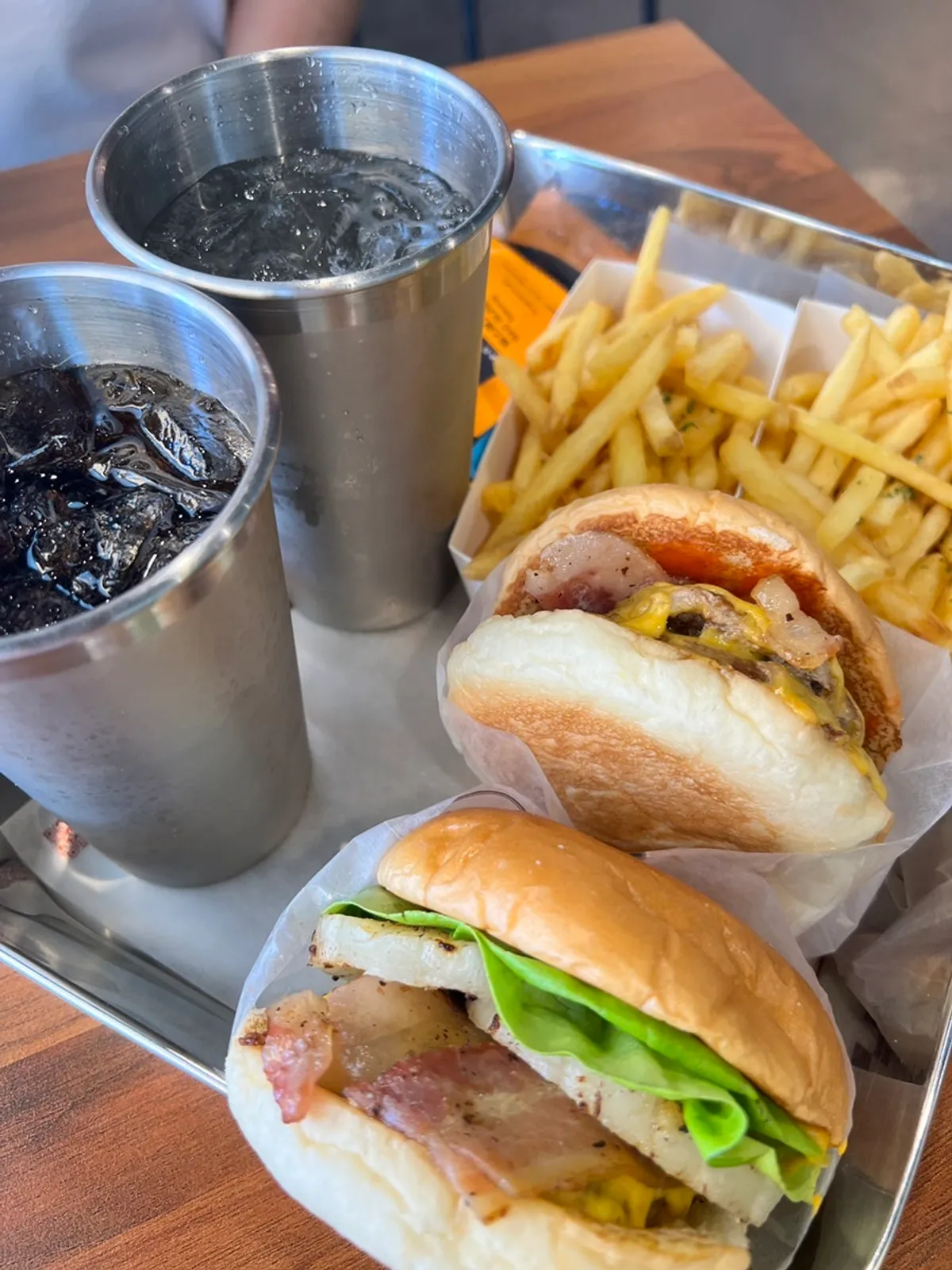 Hawaiian burger and double bacon cheeseburger sets on the table