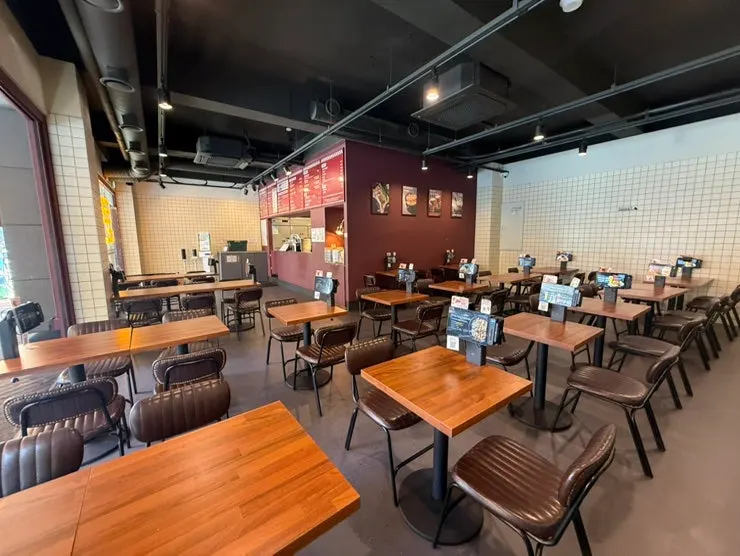 Awning-covered terrace seating at Bas Burger Samseong Station Branch