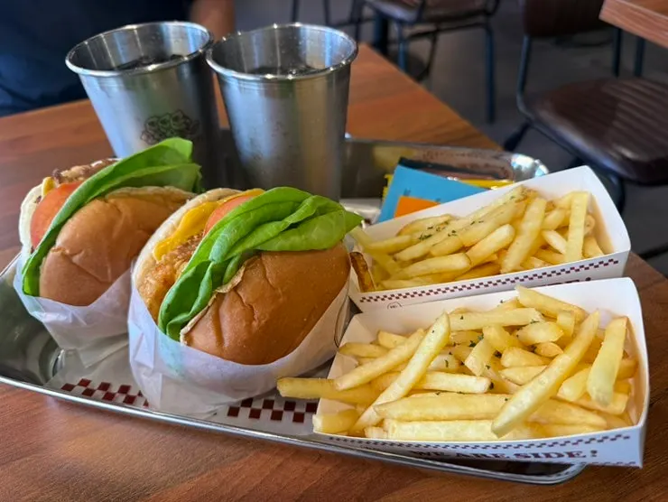 Two burger sets laid out on the table