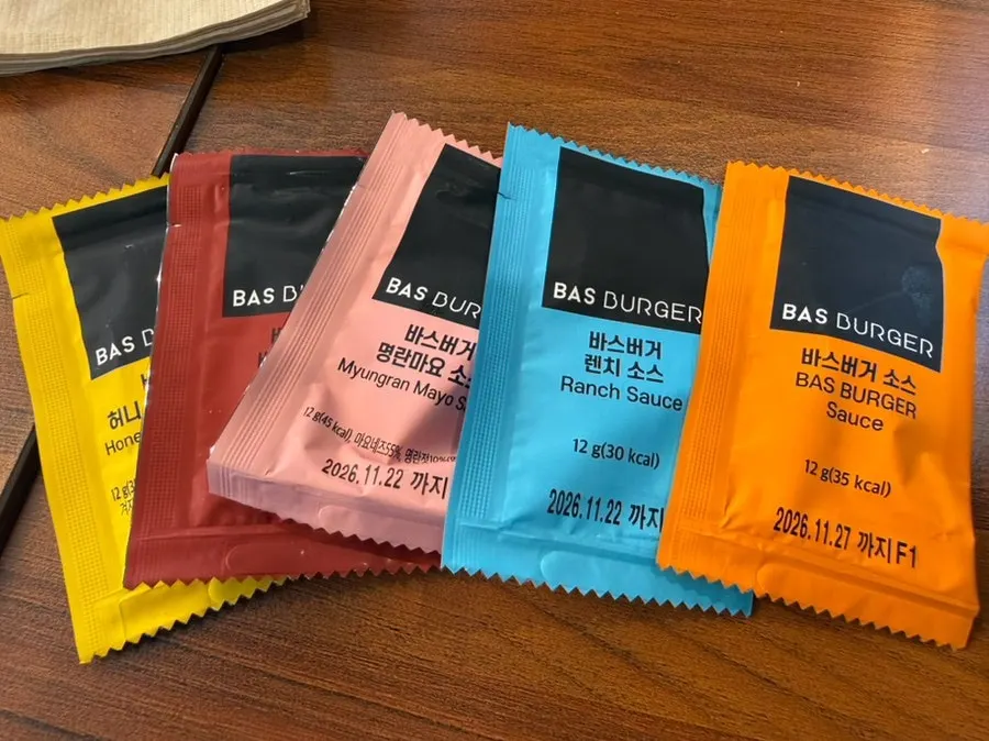 Five sauces served alongside the burgers
