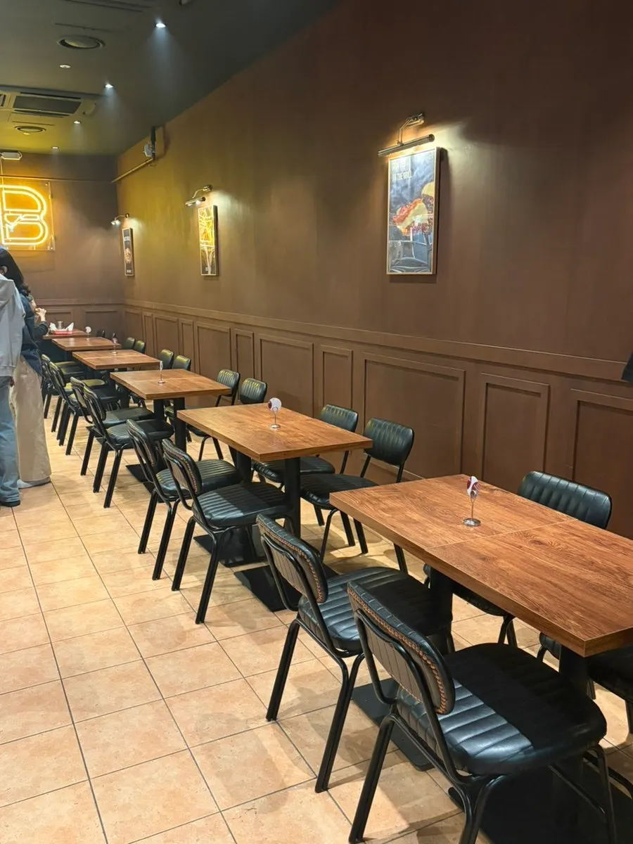 Spacious, pleasant dining hall seating at Base Burger