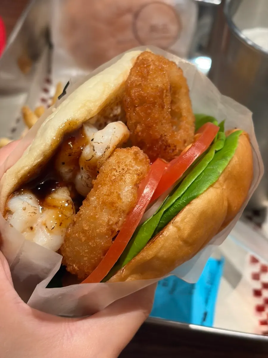 Cross-section of the shrimp burger showing the shrimp patty