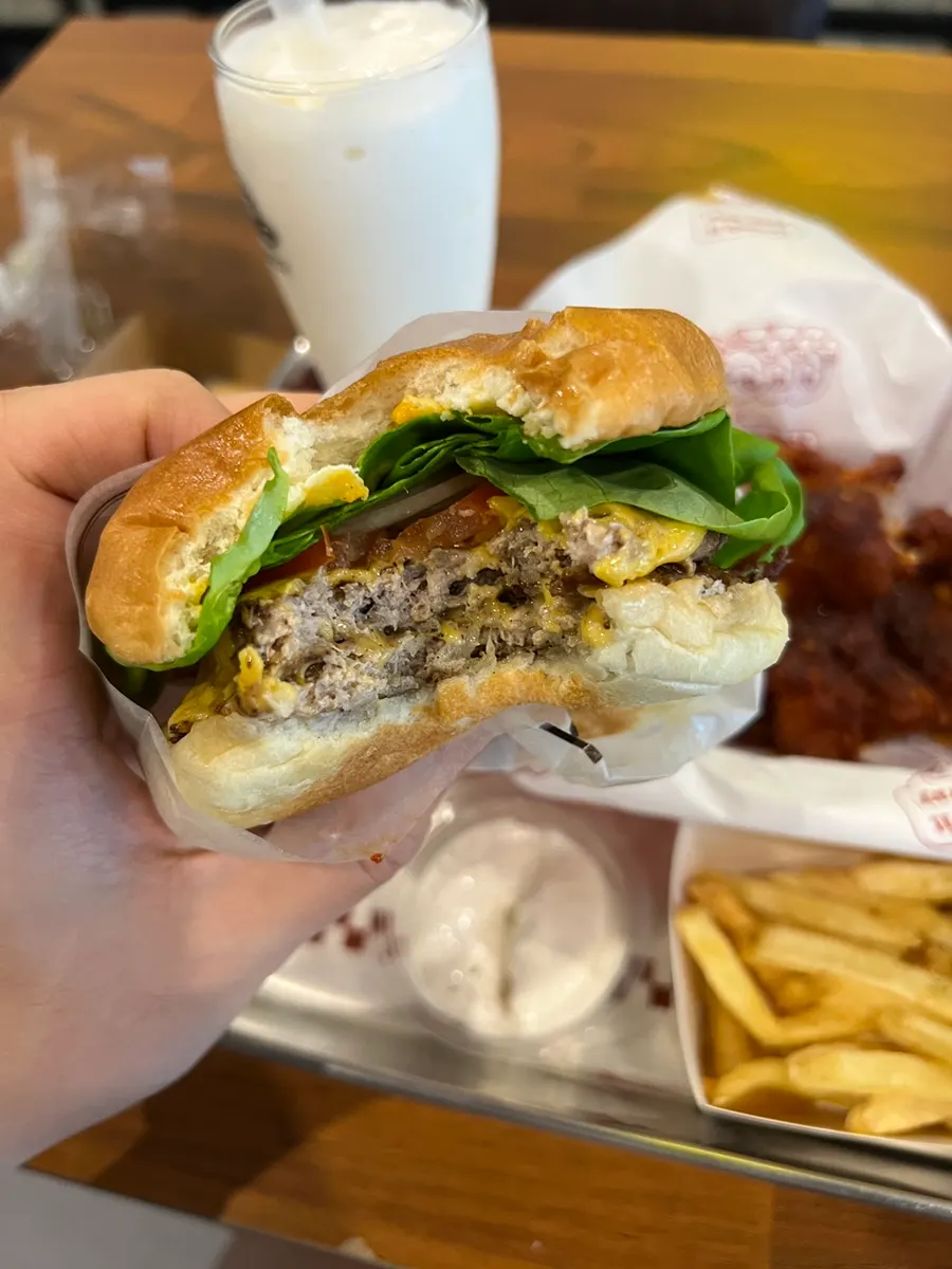 Cross-section of the burger showing fresh vegetables